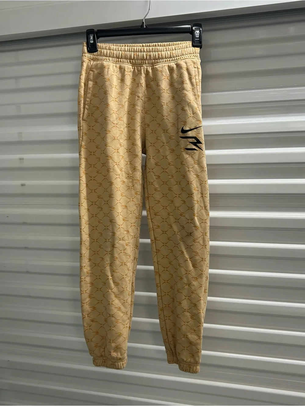 Nike Youth Light Yellow Patterned Joggers with Black Swoosh
